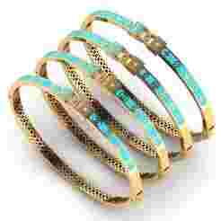 Collection of four branded enamel bracelets