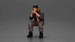 Gangster sitting in dressed casually with a beanie and jacket