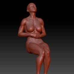 woman sitting touches her stomach