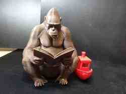 Young boy riding a cow.