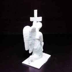 Gravestone Depicting Angel Holding the Cross