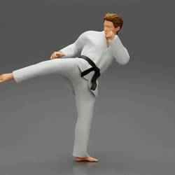 Karate man in a white kimono with a black belt