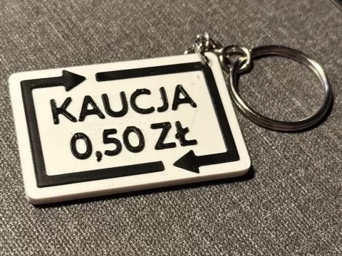 Keychain with "KAUCJA 0,50 ZŁ" text