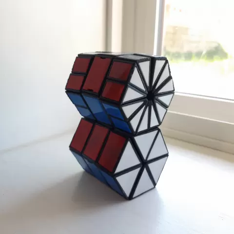 Hexagonal prism plus twisty puzzle by Ethan Buell