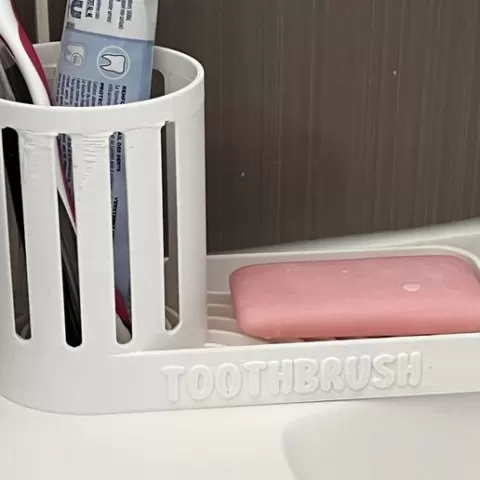 TOOTHBRUSH- Toothbrush and soap holder.