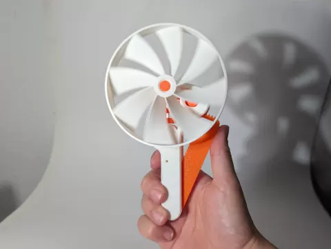 Squeeze Powered Flywheel Fan