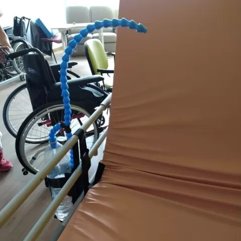Flexible bottle and straw holder