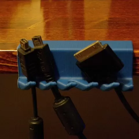 Clamp-on desk USB cable holder