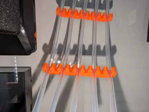 Ptfe holder and organizer for MMU