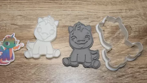 cookie cutter unicorn smiling sitting