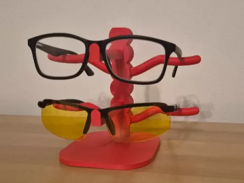 Glasses holder with arm