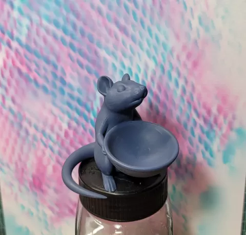 Rat holding a bowl