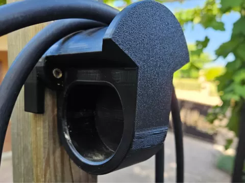 Type2 EV charger plug, cable holder on wooden pole