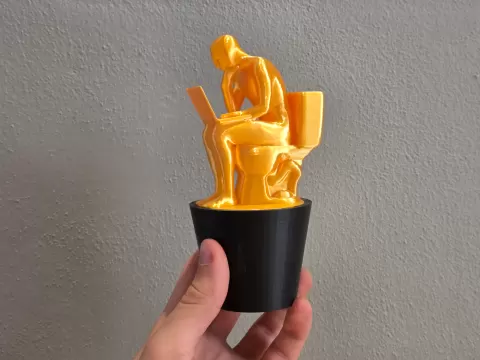 Trophy of the Thinking man on toilet