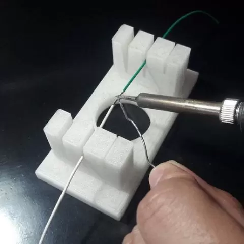Support for soldering cables.