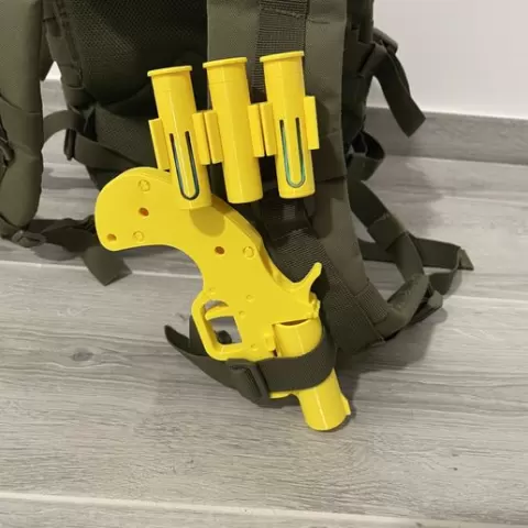 Airsoft flaregun with shell holder and spring-loaded shells