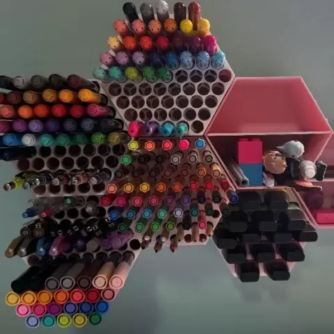 Modular hexagonal wall-mounted pen organizer