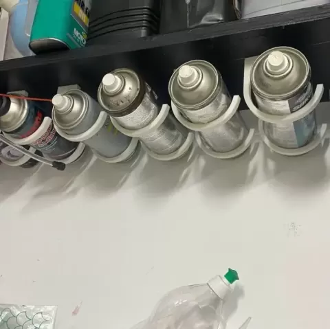 Under shelf spray can holder v2