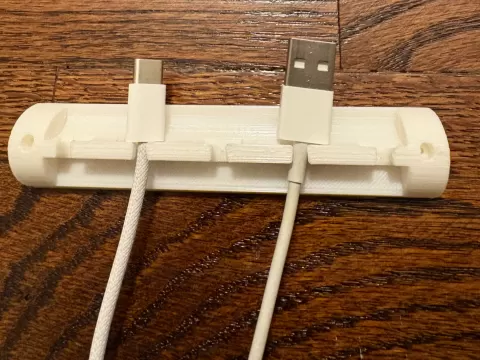 Wall-mountable cable holderby Luca Povo