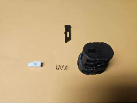 This is the lock button for a hockey bag with a telescoping handle. The original part was some kind of pot metal abomination that divorced itself from utility.