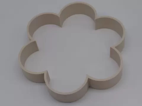 Cortador de biscoito em forma de flor.