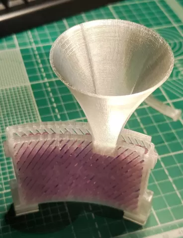 Funnel for curved spool desiccant container