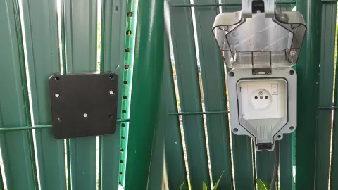 Fence backplane for waterproof power socket