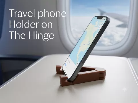 Travel phone holder on the hinge
