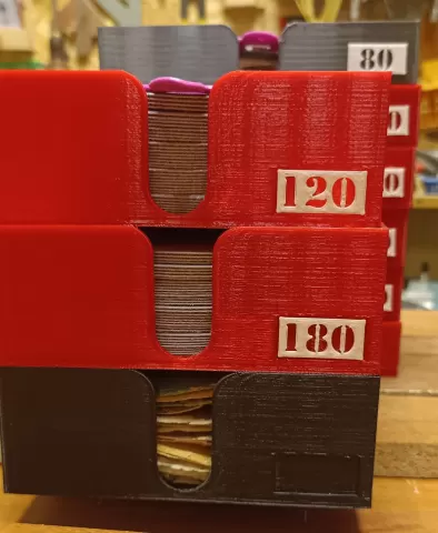 Set of trays of various depths for grinding discs, dividers, and grit labels.