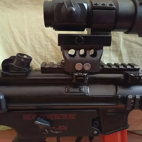 Optic riser for airsoft RIS rails