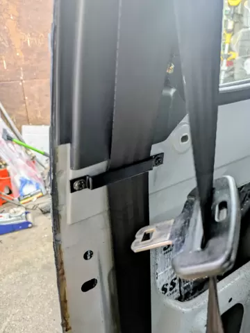 Mazda 323 BF seatbelt retention bar