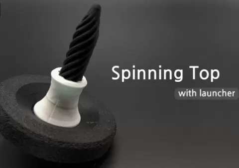 Pass Through Fidget Inspired Spinning Top: Vertical Launch