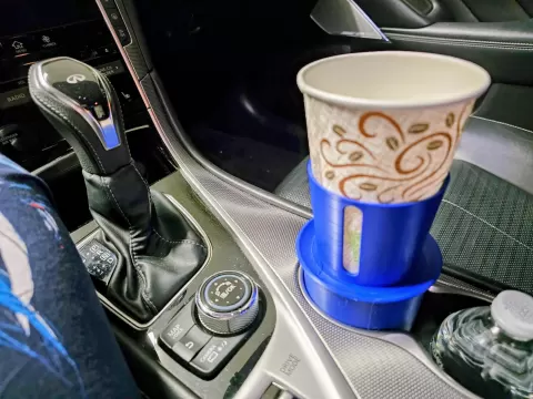 Elevated Drink Holder with Integral Saucer for Motor Vehicle