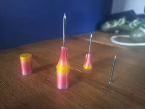 Weighted dart skirt for modular blow gun