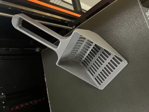 Cat litter scoop.