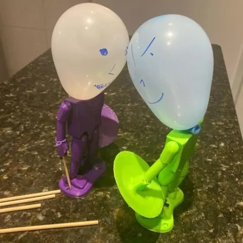 Balloon head puppet fencing fighter