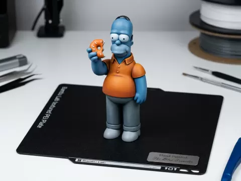 Stylized Homer Simpson with Donut Figurine