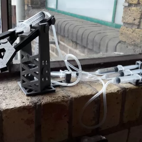 Hydraulic arm with syringes by Mathis
