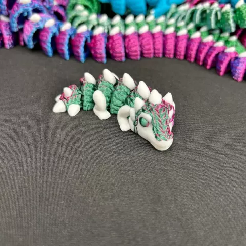 Small Knitted Dragon Fidget by Built Over Bot