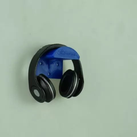 simplistic headphone holder with silverstone company name and logo with recognition of the designer AND INTEGRATED BOTTLE OPENER by Jack P Durham