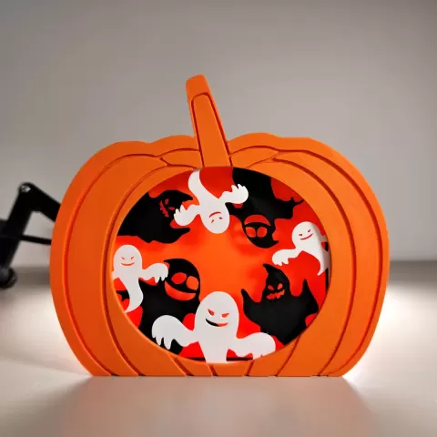 Ghosts in a Pumpkin Silhouette