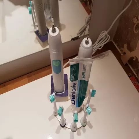 Five toothbrushes Sonicare stand
