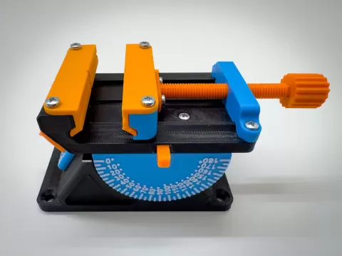 Multi-axis vice with interchangeable attachments.